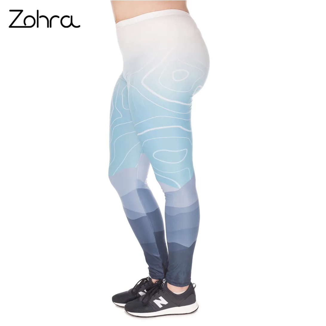 A product display of women's fitness leggings with a distinctive ombre gradient design fading from white at the top to dark blue at the bottom. The leggings feature an abstract line pattern overlay and are shown being worn with black athletic shoes. The Zohra brand logo appears in the upper left corner.